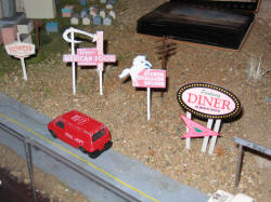 Miniature signs( by Mike Erzen) of old motels and other vintage 66 places 